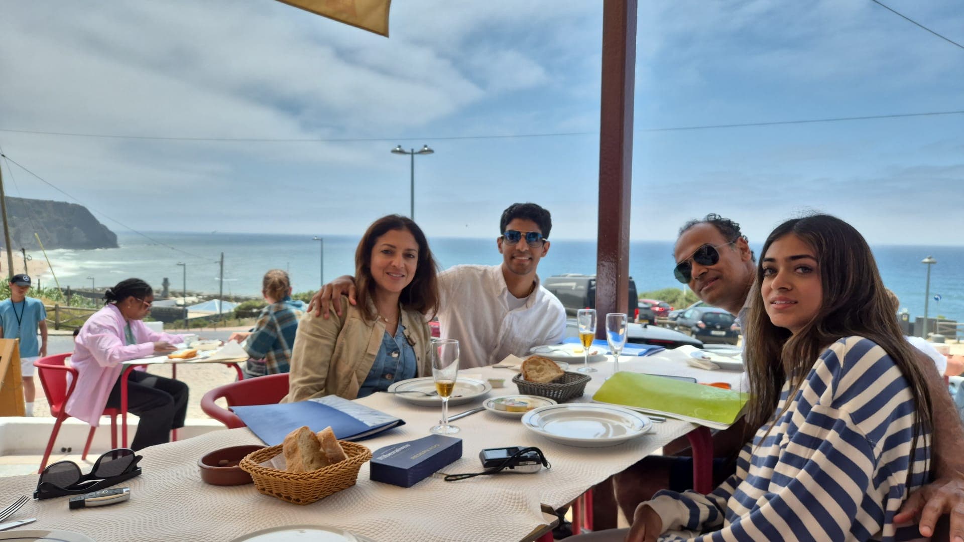 Travel-Luck travelers sharing a relaxed meal by the water