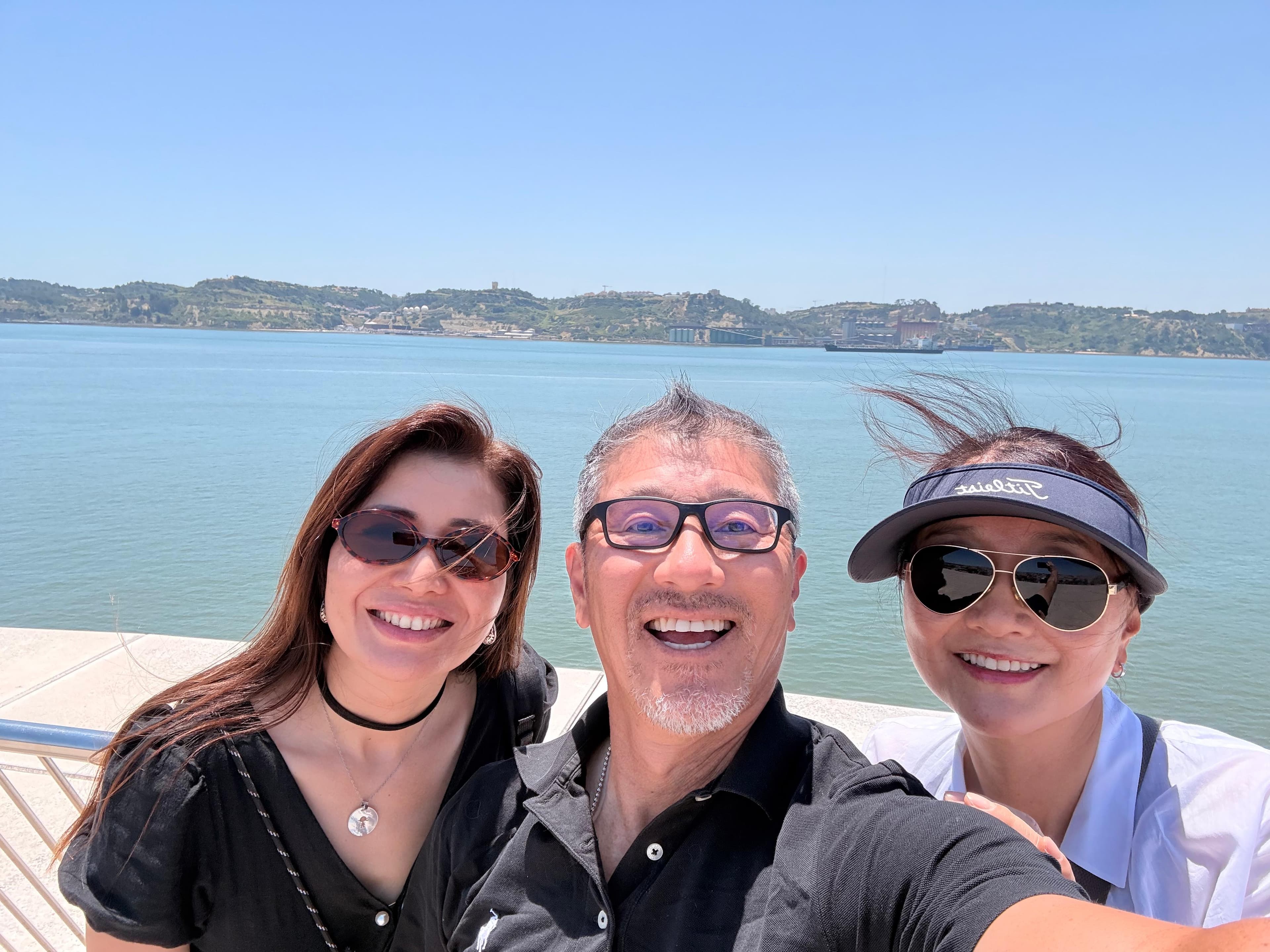 Travel-Luck clients smiling together by the Atlantic coast